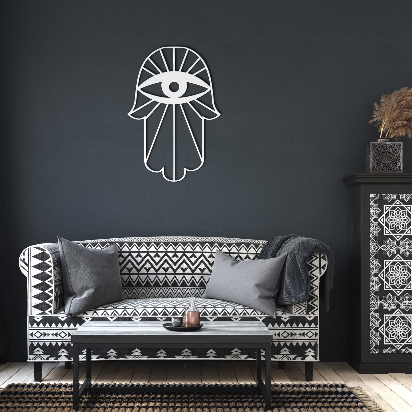 A metal sign of a Hamsa with an evil eye